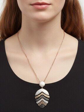 Liz Claiborne multi-gold colored stylized leaf necklace 30" chain.